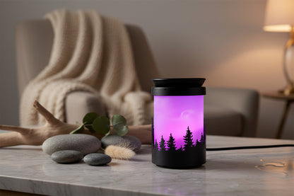 Black wax melt burner with purple and pink gradient design of trees and sky 