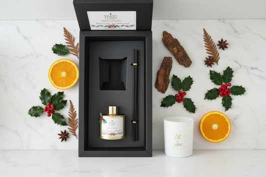Bitter Orange & Cedarwood Winter Collection Gift Set with white frosted candle and gold reed diffuser in black gift box with orange and cedarwood botanicals