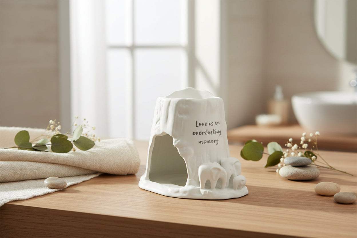 White elephant-shaped tealight burner with 'Love is an everlasting memory' text