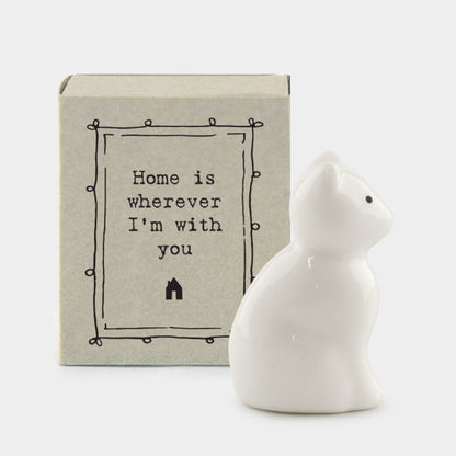 White ceramic cat with a box featuring 'Home is wherever I'm with you' text on a white background