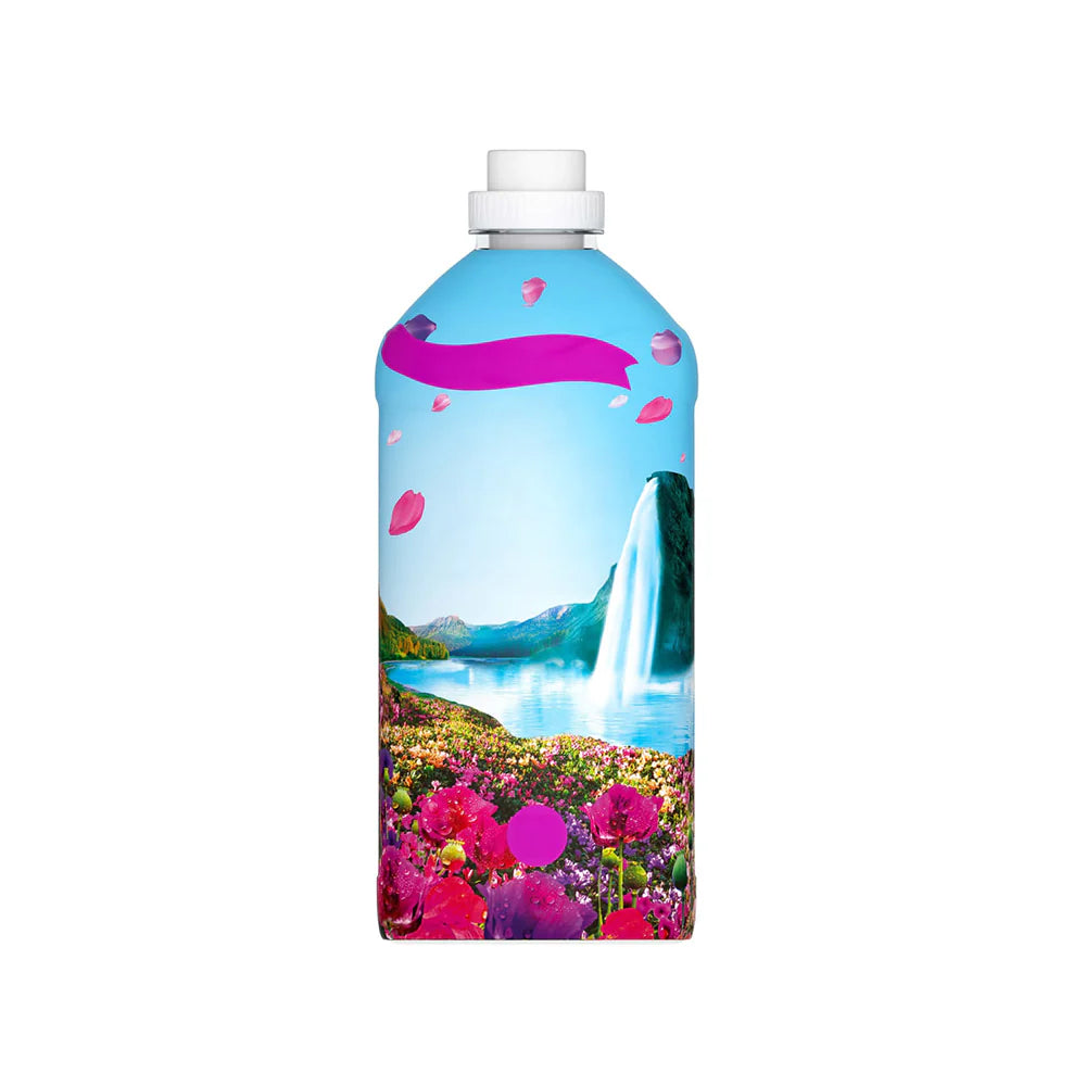 Bottle with scenic design featuring a waterfall and pink flowers on a white background