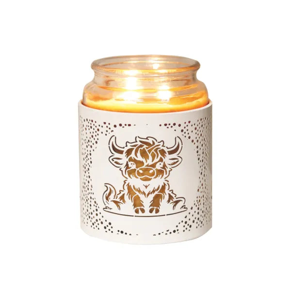 Ceramic candle holder with a bull design on a white background