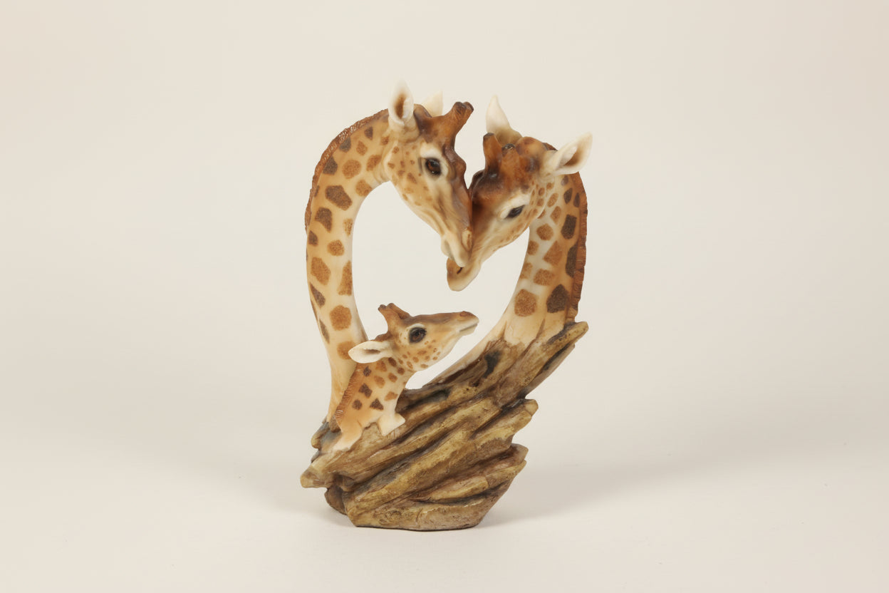 Giraffe family figurine on a white background