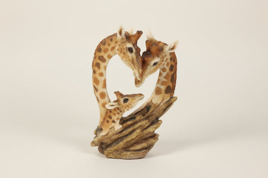Giraffe family figurine on a white background
