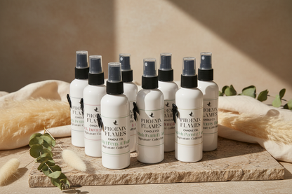 Multiple bottles of Phoenix Flames Candle Co room and linen mist sprays