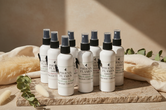 Multiple bottles of Phoenix Flames Candle Co room and linen mist sprays