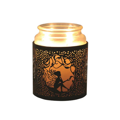 Decorative candle holder with fairy design on a white background