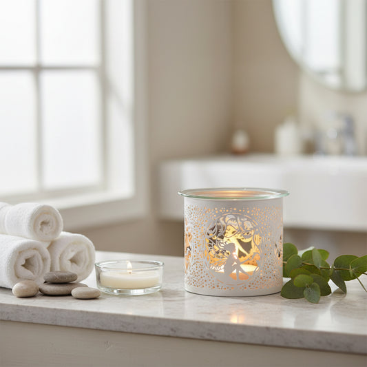 Decorative candle holder with cut-out design of a fairy