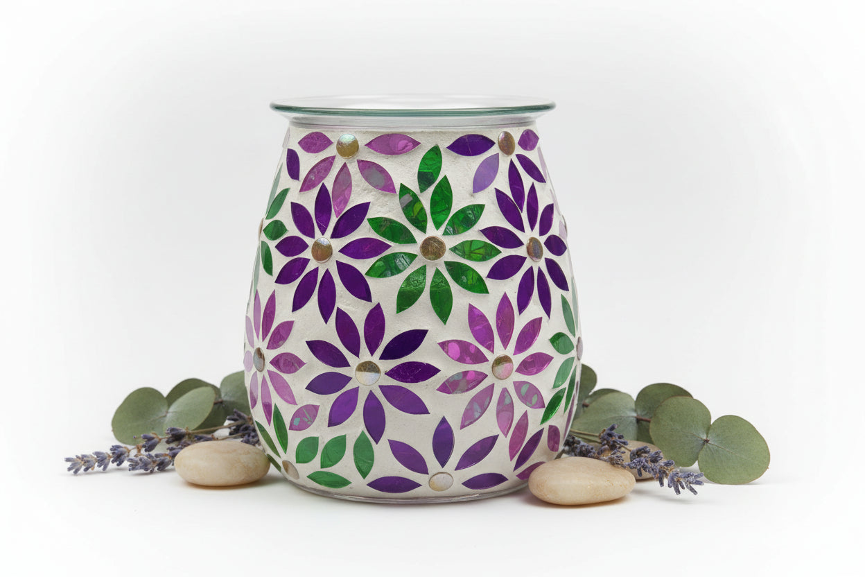 Decorative wax warmer with floral pattern on a white background
